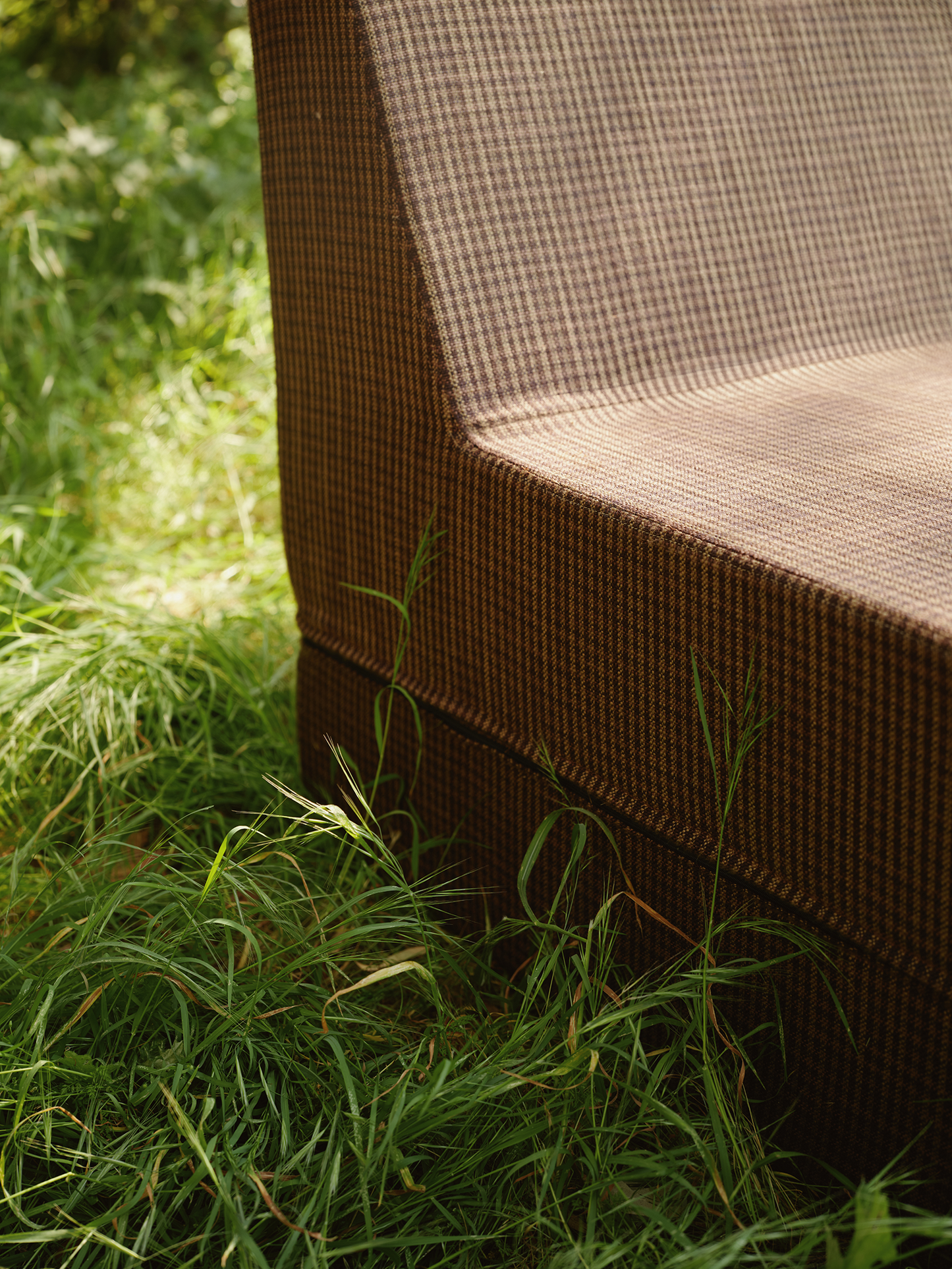 Chair detail checkerboard pattern in grass