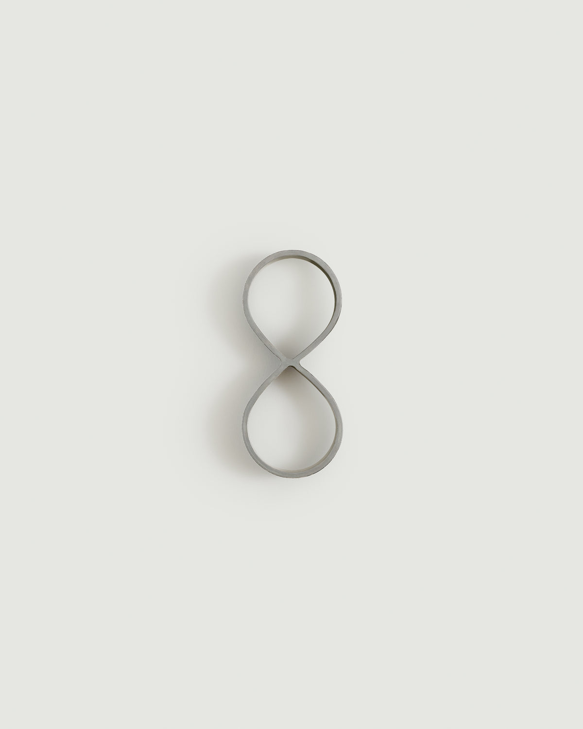 Worn silver house number eight