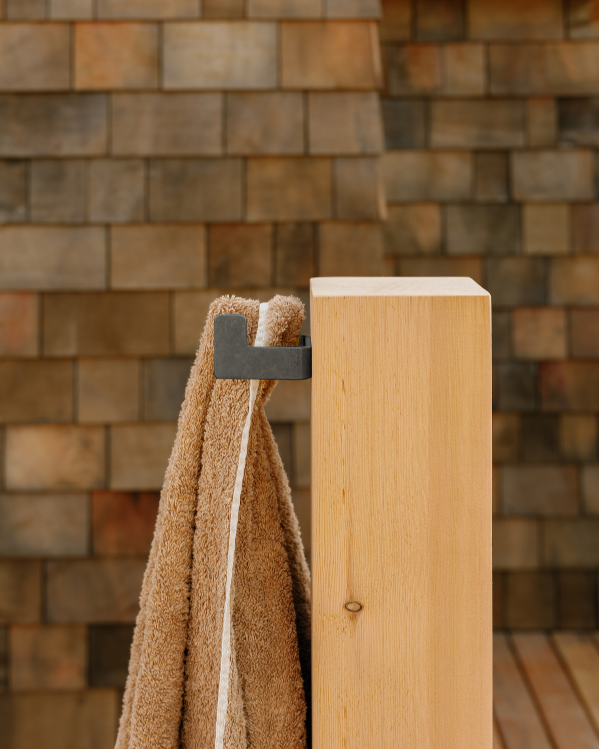 small black hook on wood post
