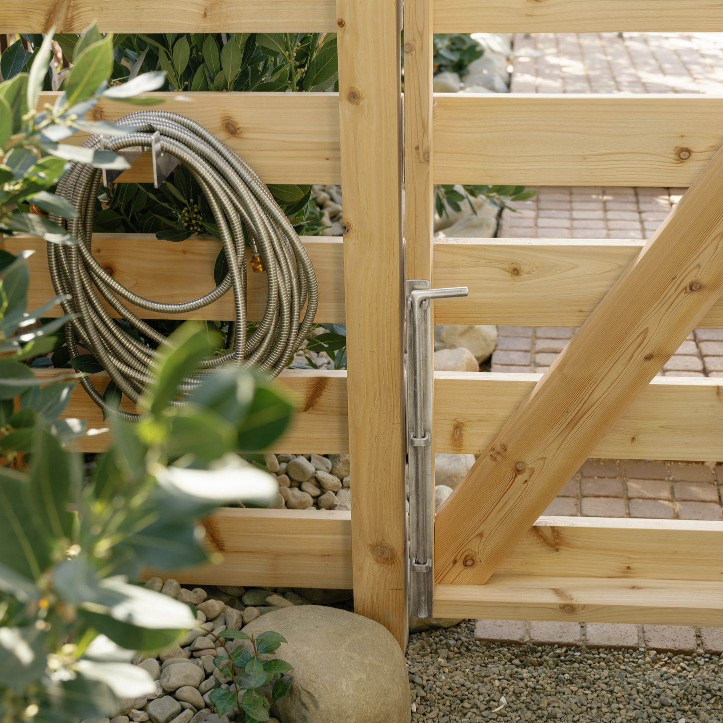 Hose hanger and cane bolt gate