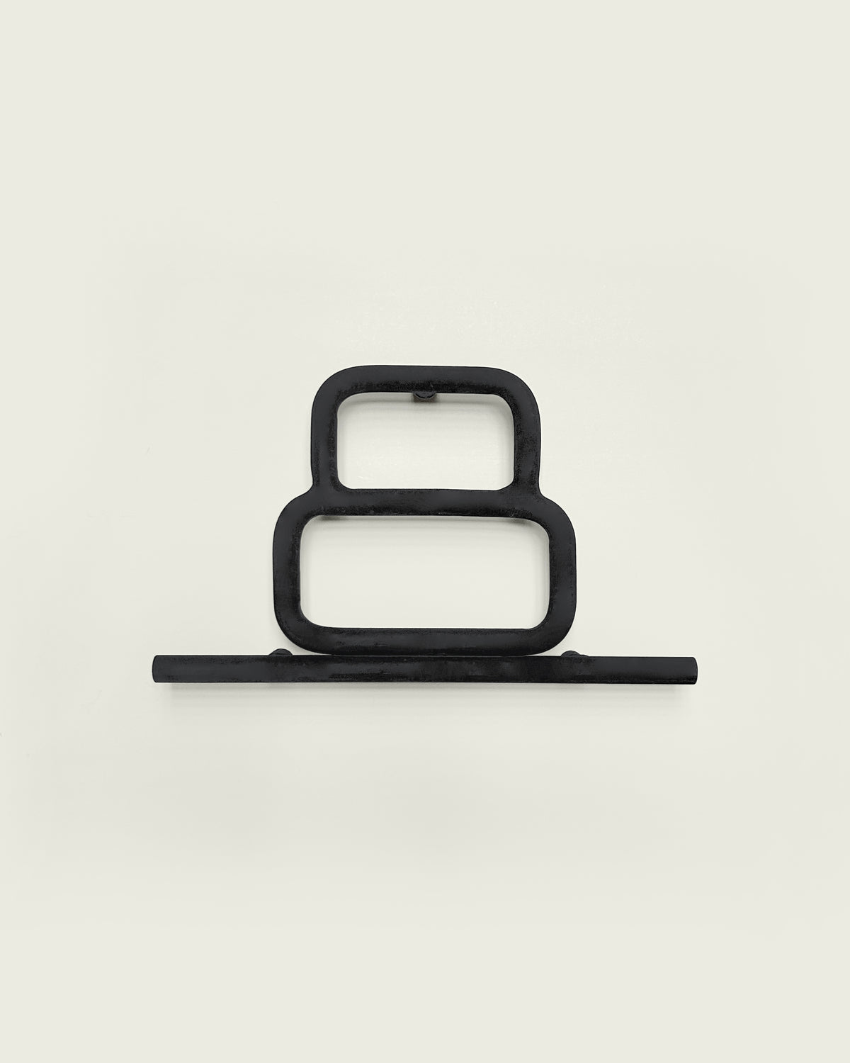 Black house number '8' on a white wall