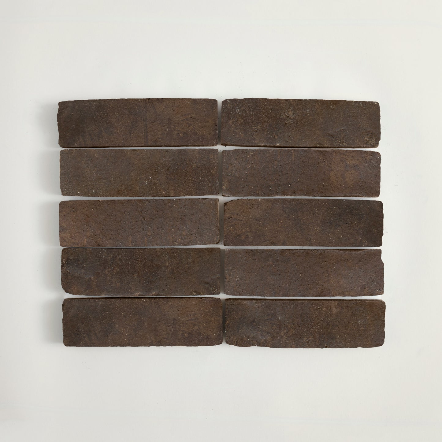Set of dark stone bricks on a light gray background