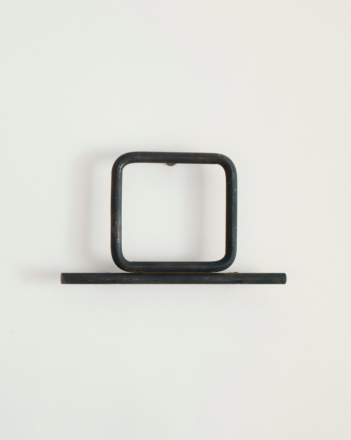 Black house number '0' on a white wall