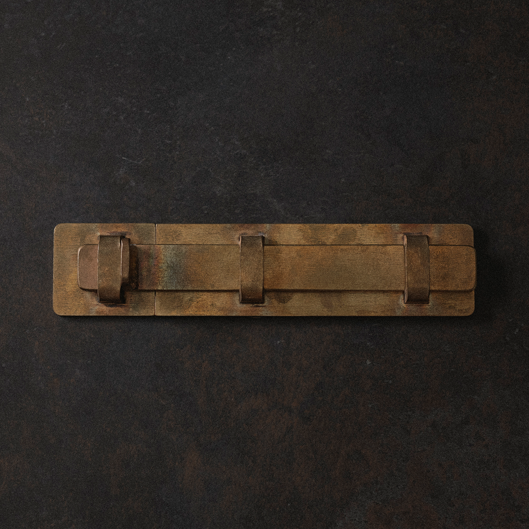 Brass slide bolt on black background