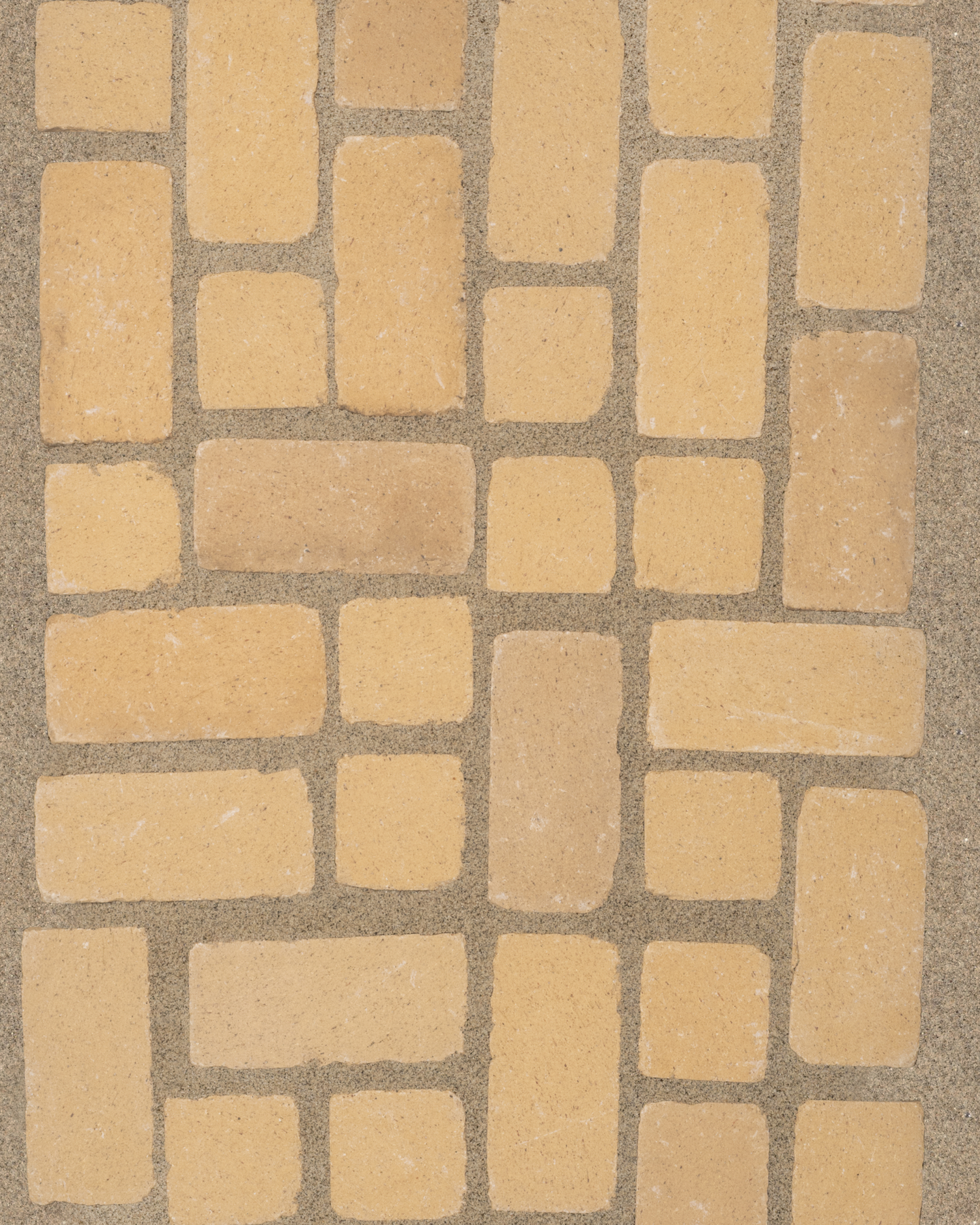 Irregular cotto paver pattern installed in sand