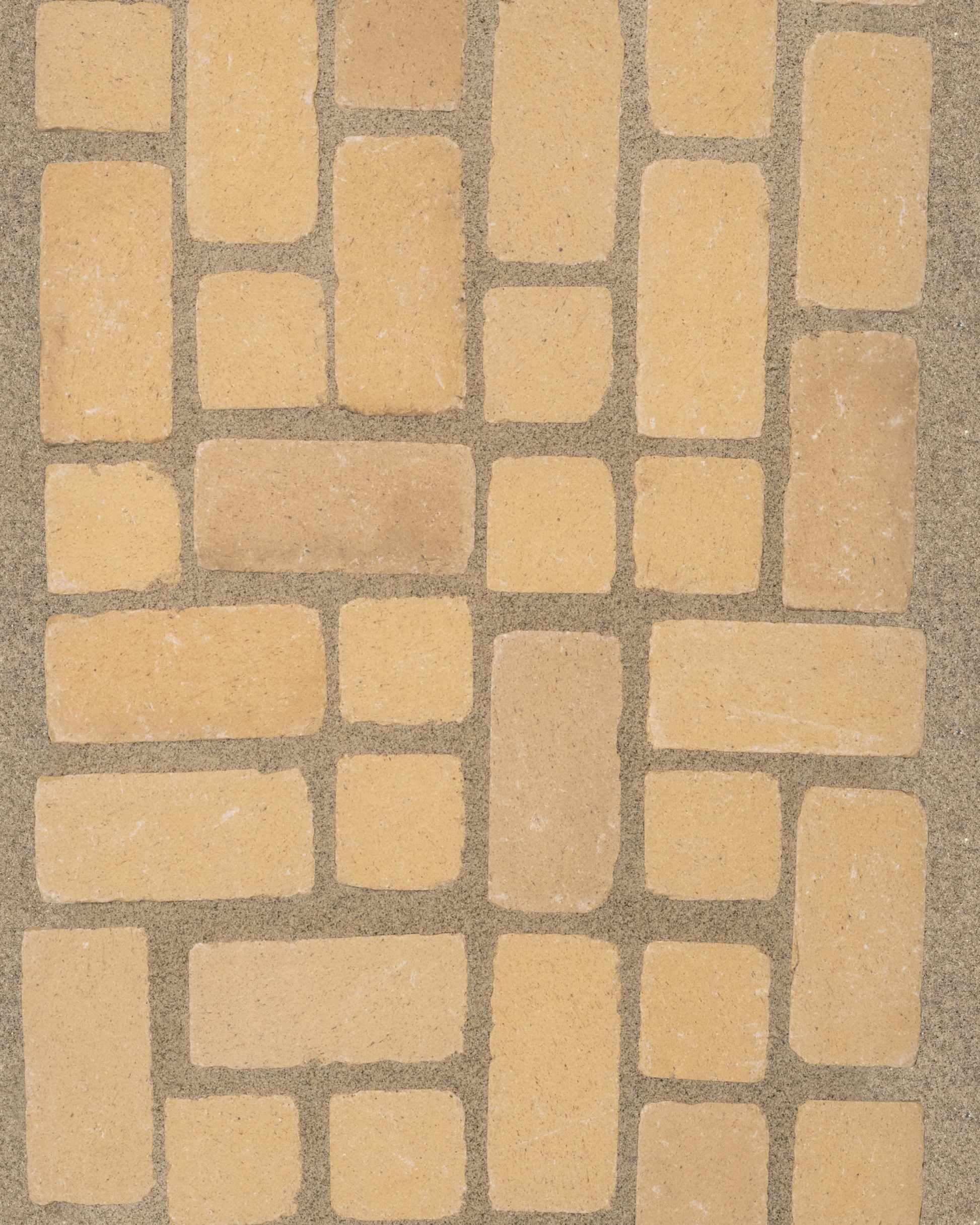 Irregular cotto paver pattern installed in sand