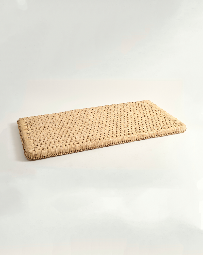 Rectangular woven mat on a white background
