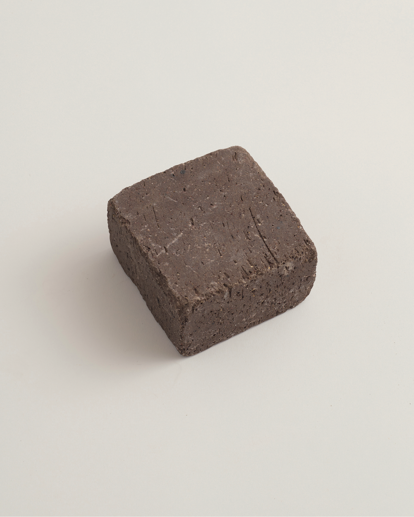 cobble dark brown brick on a light beige background