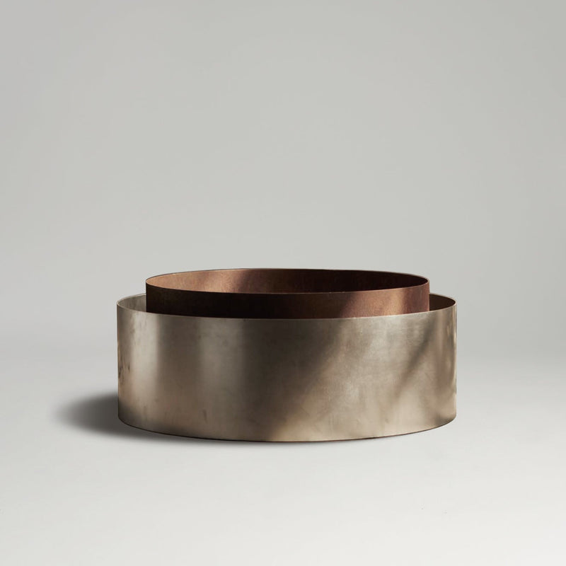 Concentric fire pit on a light gray background