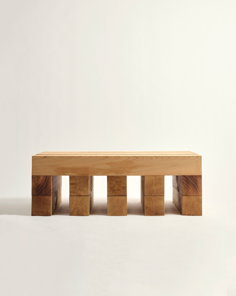 Wooden bench with block design on a light background