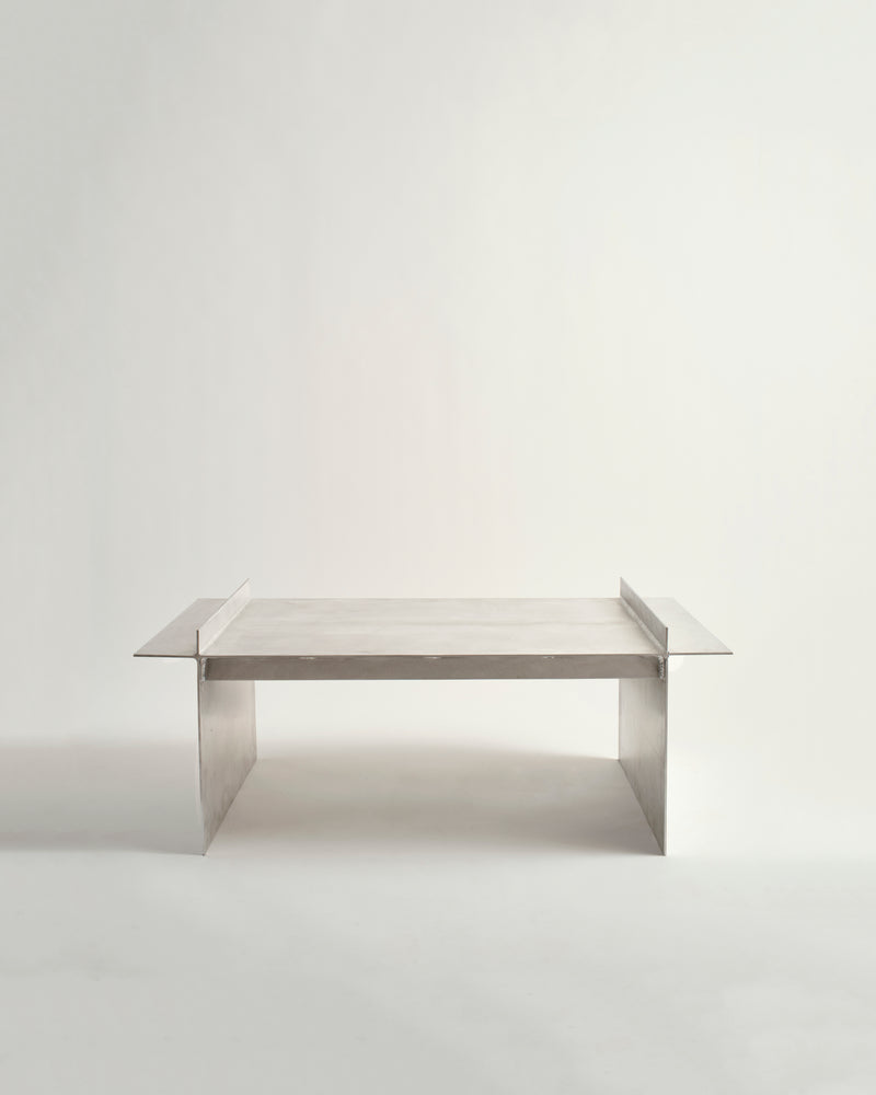Stick bench with a reflective surface on a plain background