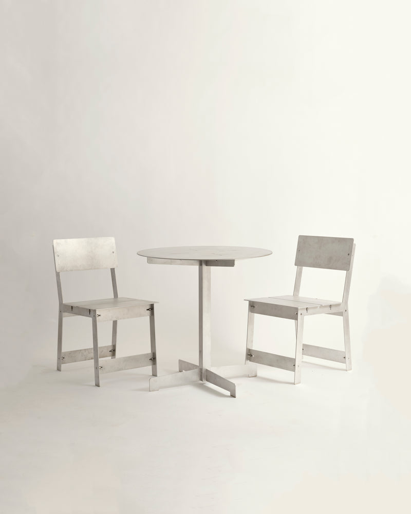 Sundial Bistro Set of two chairs and a small table on a white background