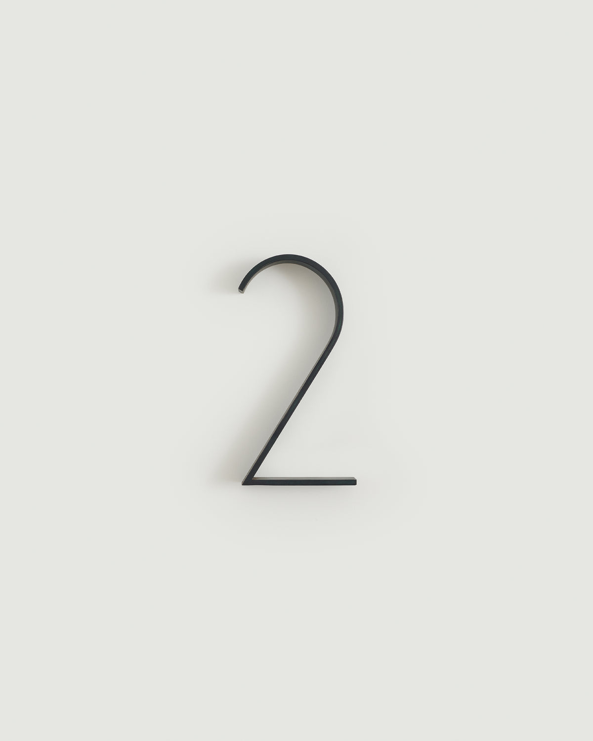 Blacked brass house number two