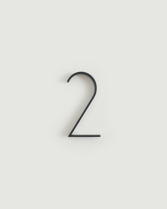 Blacked brass house number two