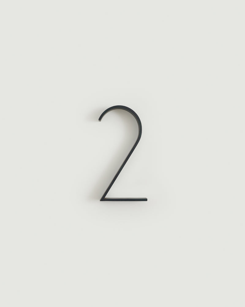 Blacked brass house number two