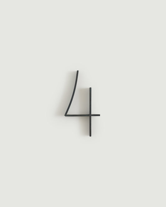 Blacked brass house number four