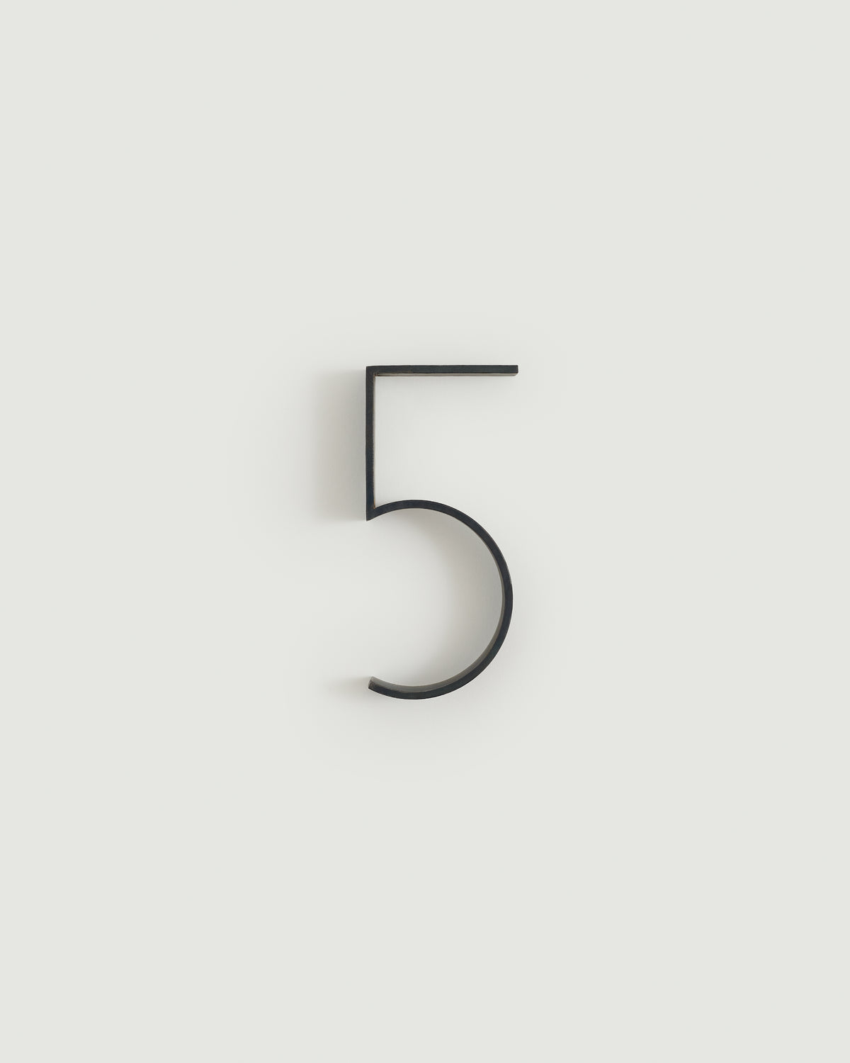 Blacked brass house number five