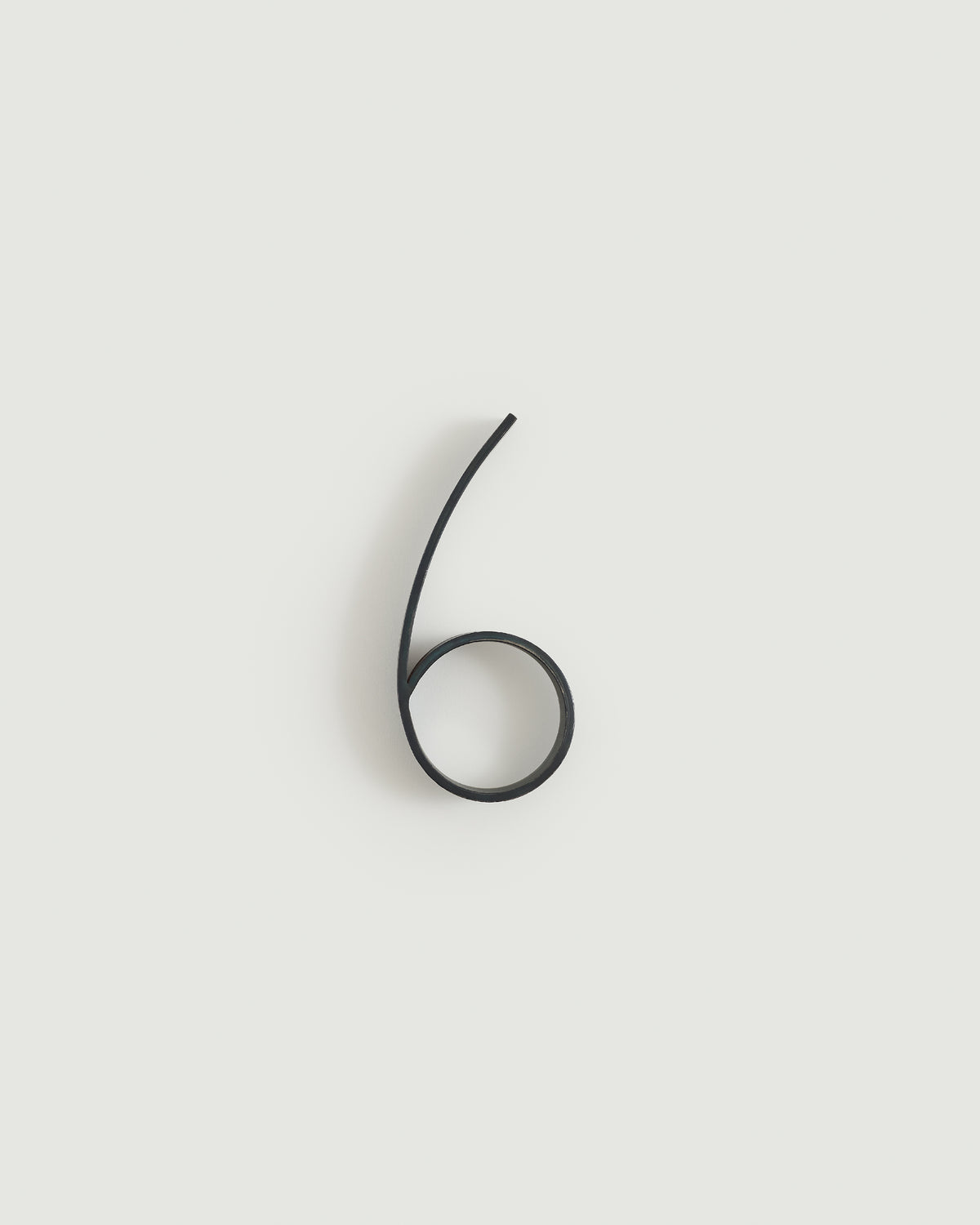 Blacked brass house number six