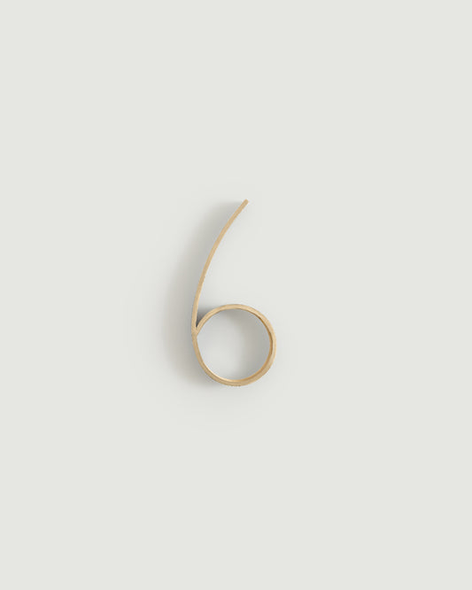Raw brass house number six