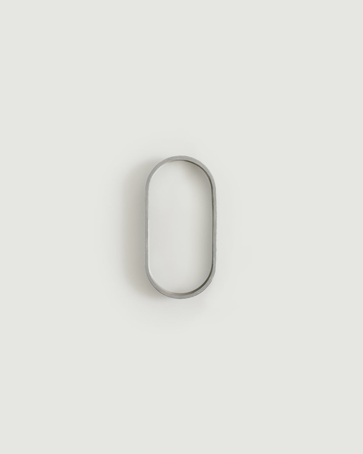 Worn silver house number zero