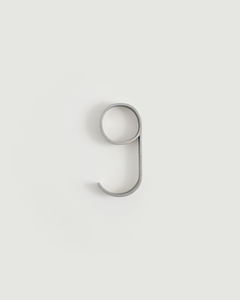 Worn silver house number nine