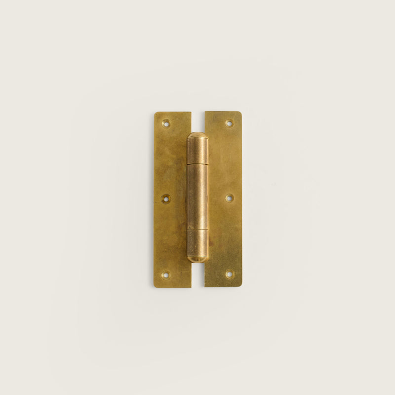 A raw brass hinge suitable for garden doors and gates, displayed on a white background.