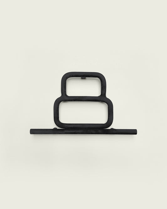 Black house number '8' on a white wall 