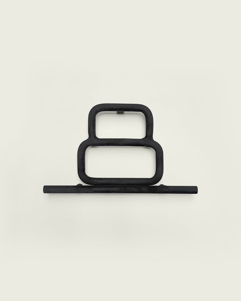 Black house number '8' on a white wall 
