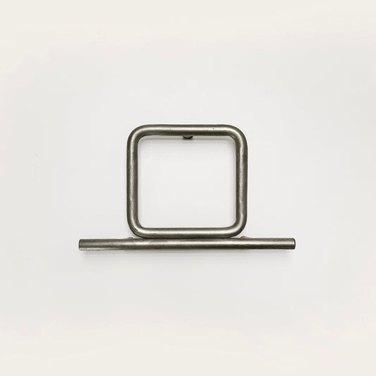 Silver house number '0' on a white wall 