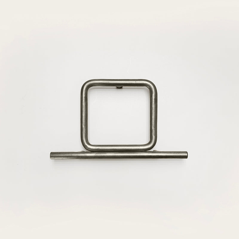 Silver house number '0' on a white wall 
