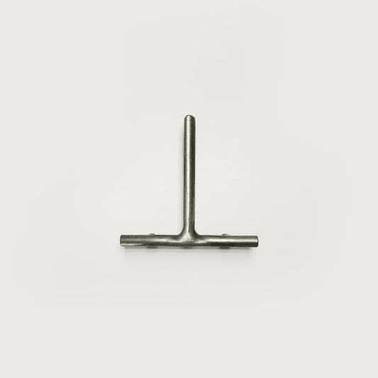 Silver house number '1' on a white wall 