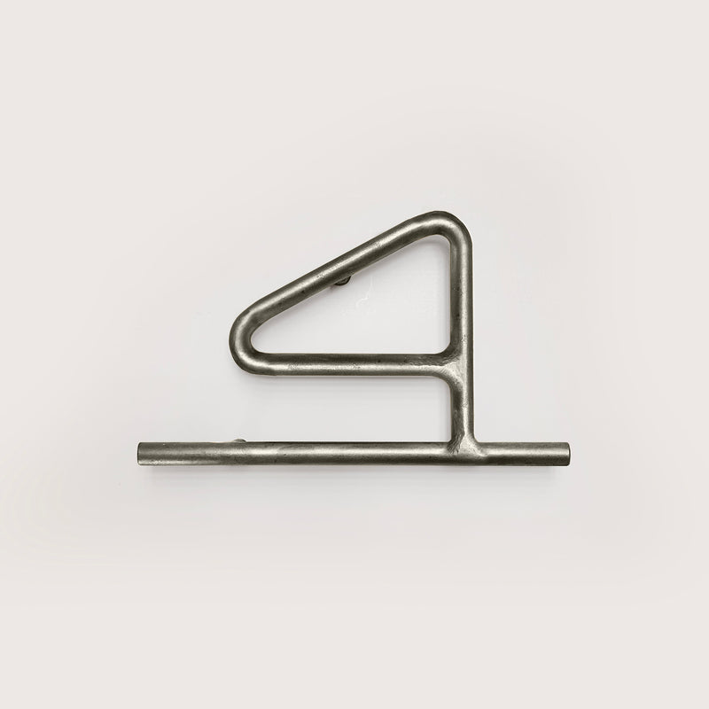 Silver house number '4' on a white wall 