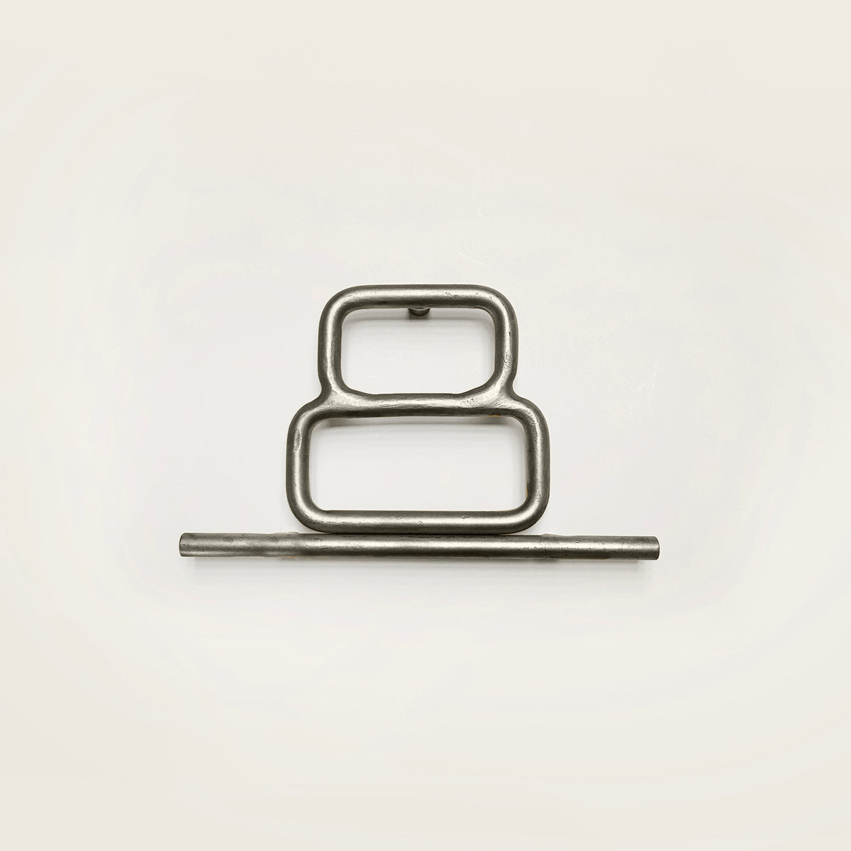 Silver house number '8' on a white wall 