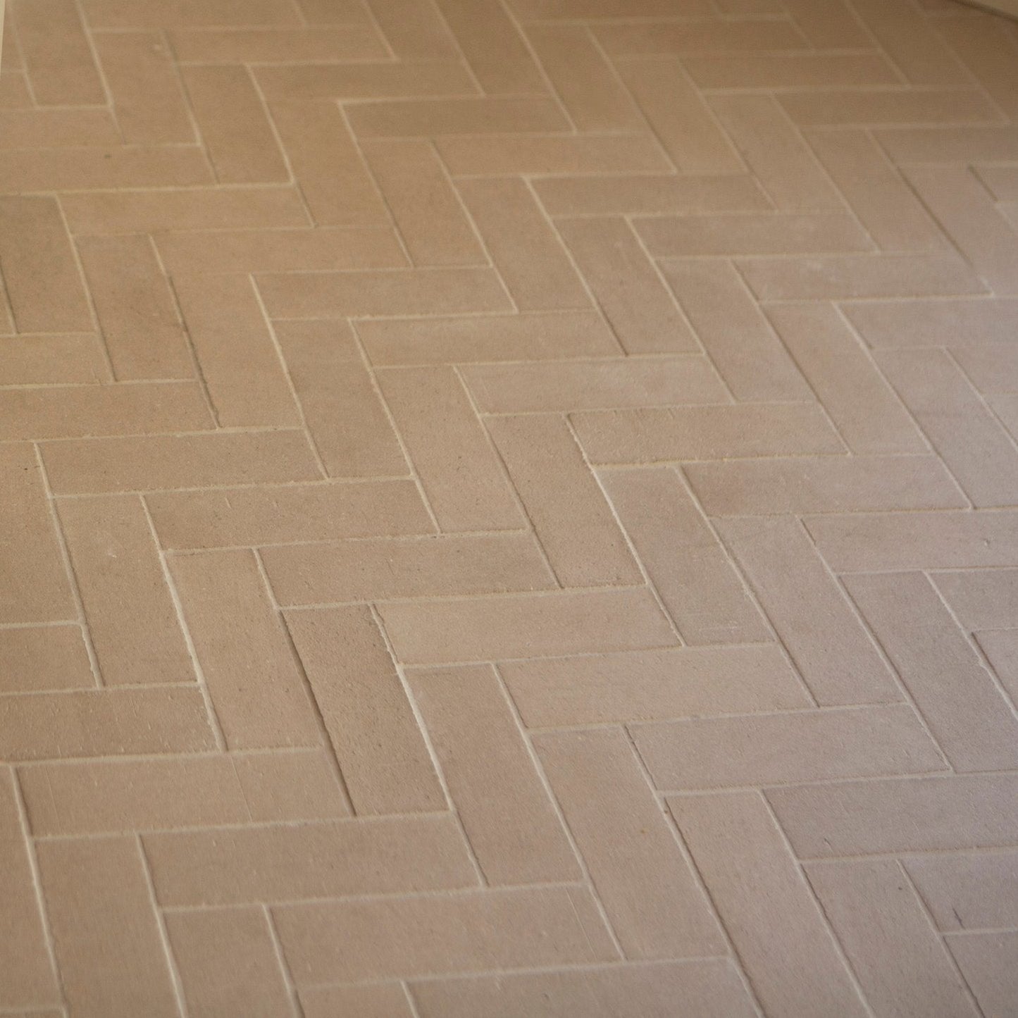 a tiled herringbone brick ktichen