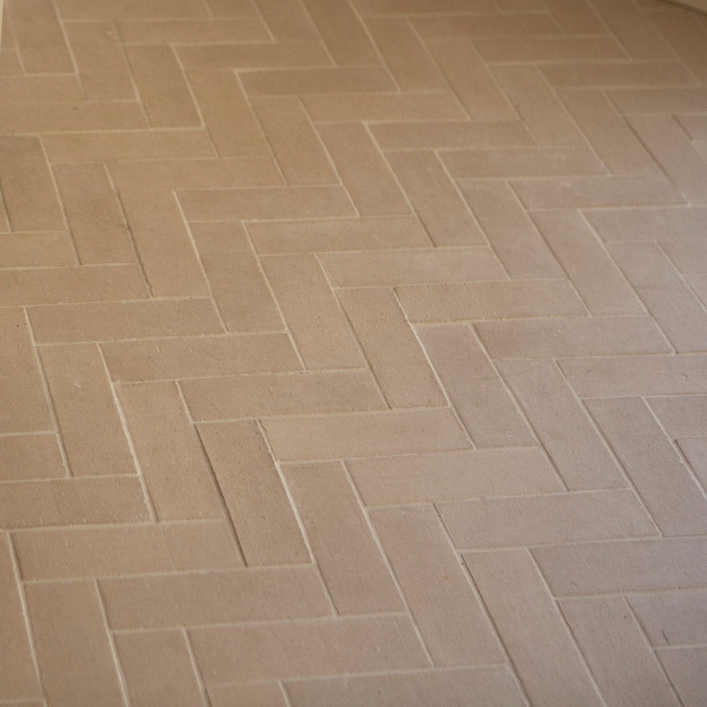 a tiled herringbone brick ktichen