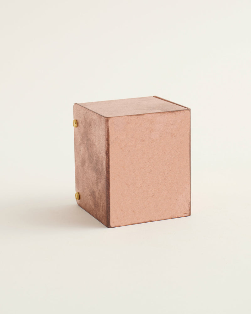 copper block sconce on white background