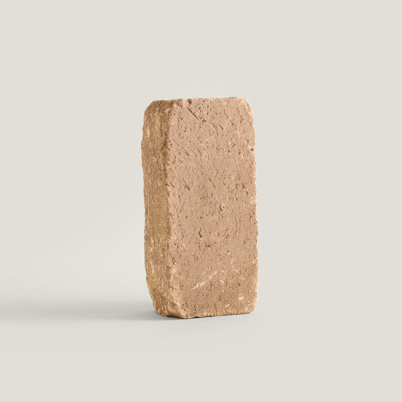 Cotto paver block on a light gray background