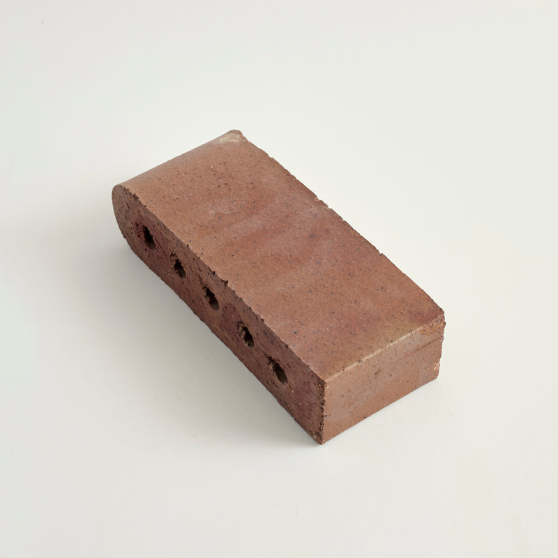 Adobe colored bullnose paver on light gray background