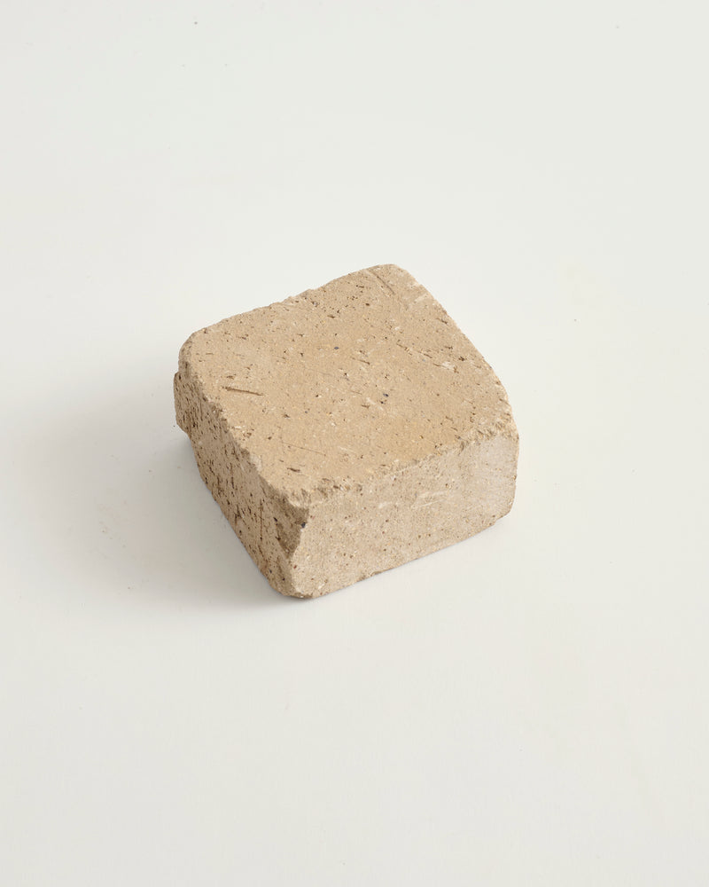 Copal cobble paver on a white background
