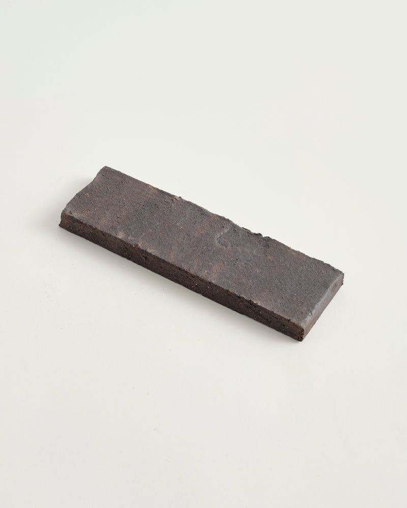 dark stone tile on a light gray background