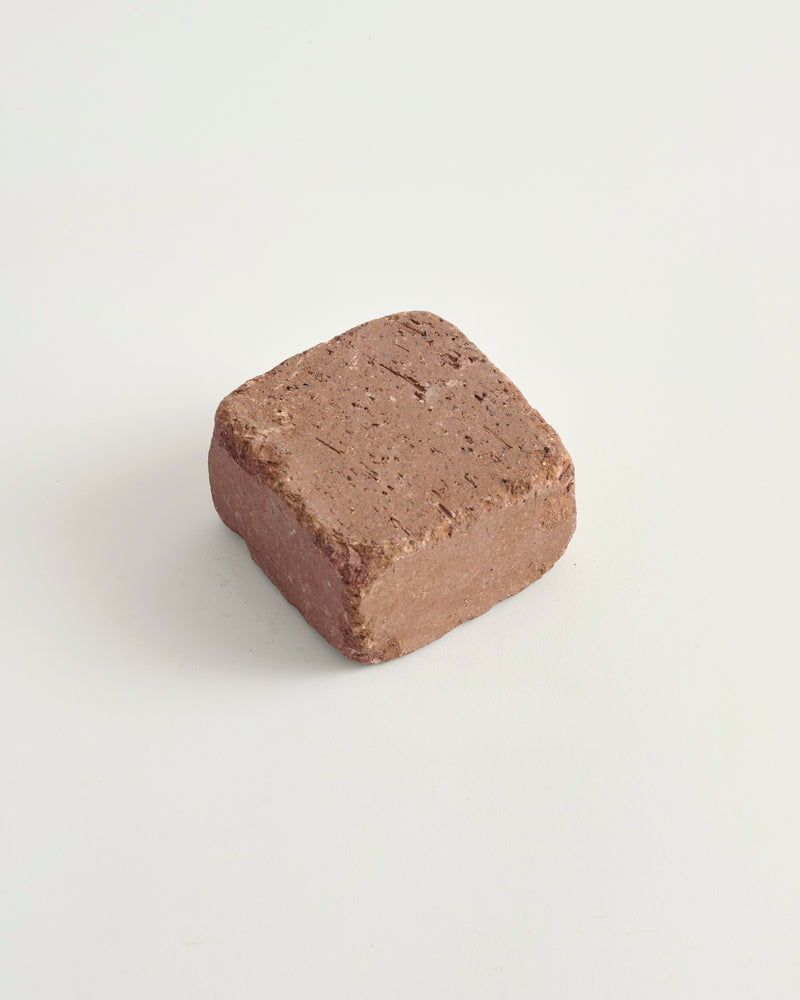 Adobe cobble brick on a light gray background