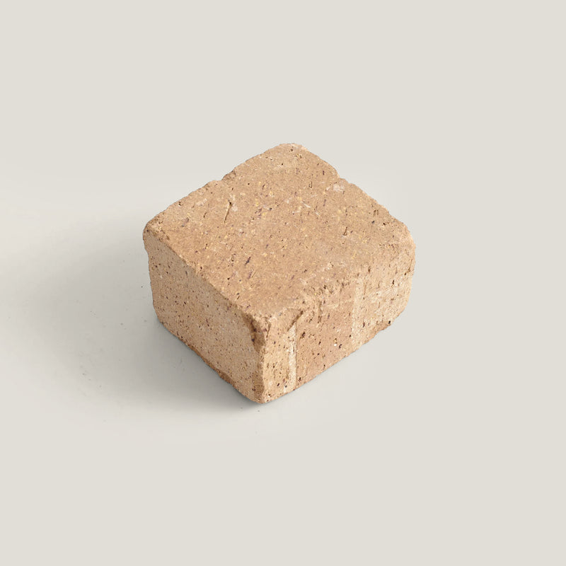 Cotto cobble block on a light gray background