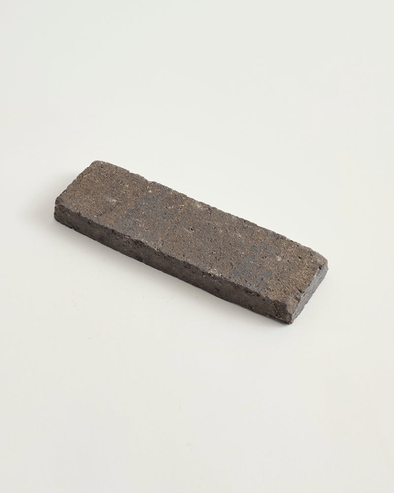 Worn tile paver in char color
