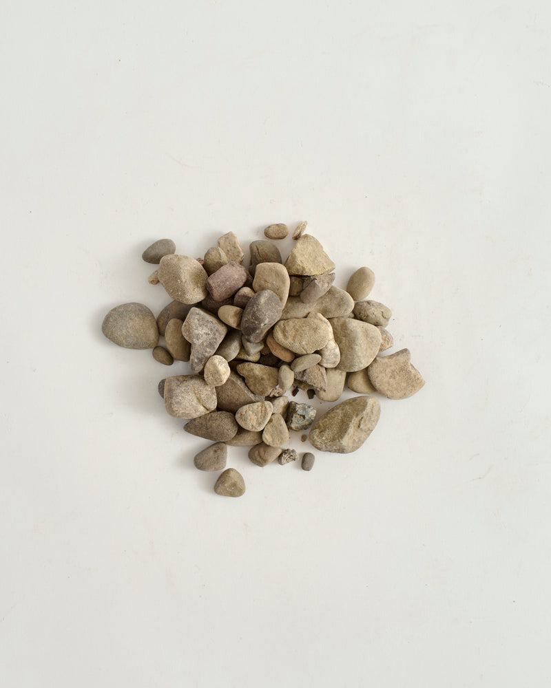 Small stones on a light gray background