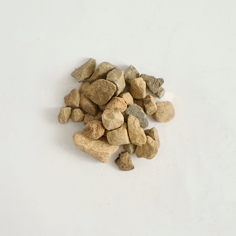 Small stones on a light gray background