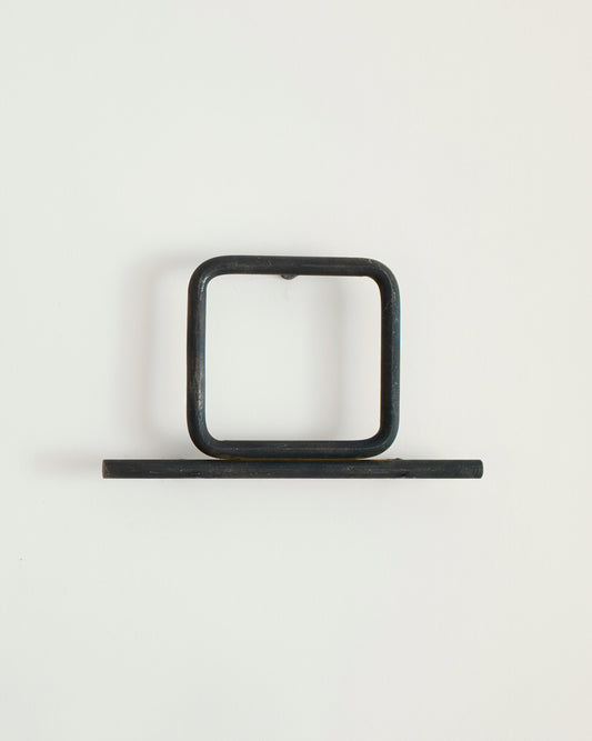 Black house number '0' on a white wall 