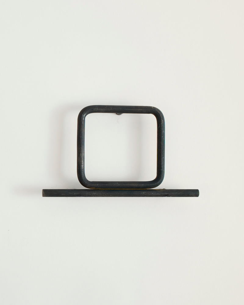 Black house number '0' on a white wall 